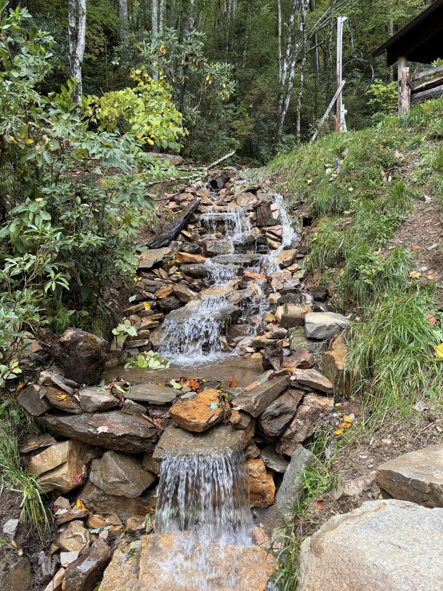 Landscape water feature with natural stone