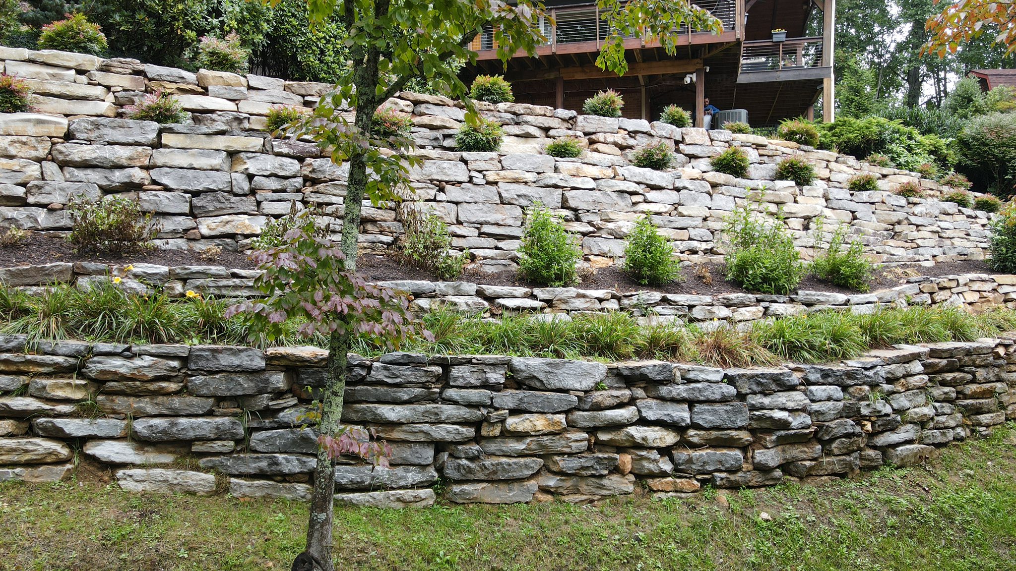 Tiered retaining walls with landscaping