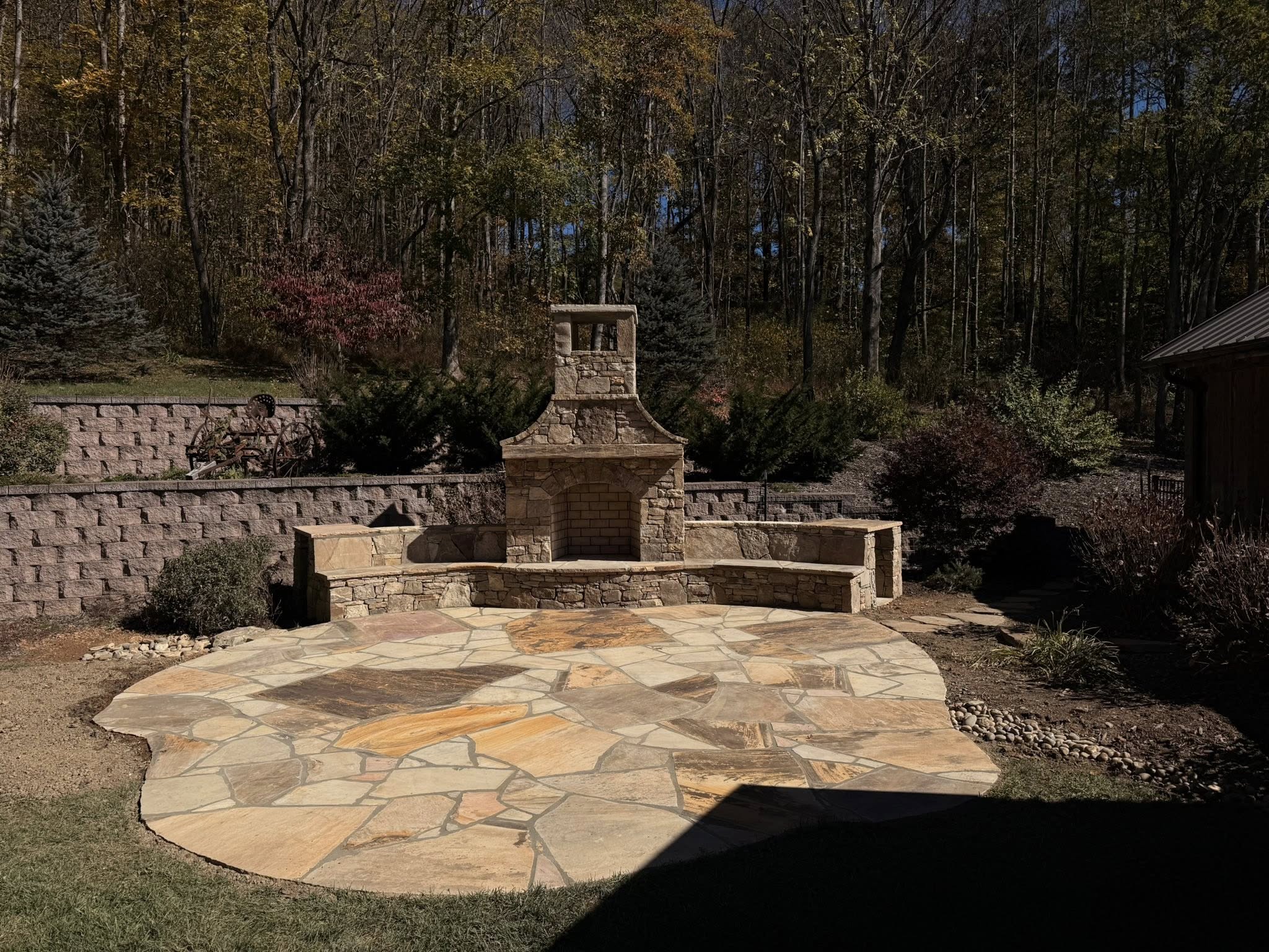 Outdoor stone fireplace and kitchen area
